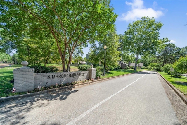 8174 Ravenhill Dr Unit 54, Germantown, TN 38138 - view of asphalt road with curbs and street lights