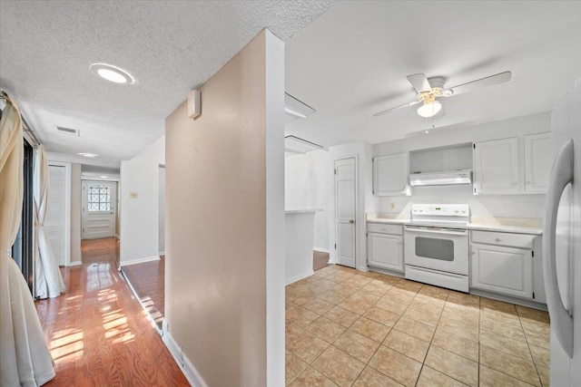 8174 Ravenhill Dr Unit 54, Germantown, TN 38138 - kitchen with white range with electric cooktop, under cabinet range hood, open shelves, light countertops, and a textured ceiling