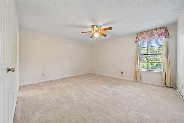 8174 Ravenhill Dr Unit 54, Germantown, TN 38138 - empty room with a ceiling fan, light carpet, a textured ceiling, and baseboards
