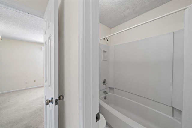8174 Ravenhill Dr Unit 54, Germantown, TN 38138 - bathroom with a textured ceiling, shower / bathtub combination, and baseboards
