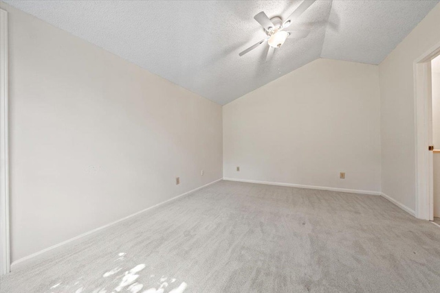 8174 Ravenhill Dr Unit 54, Germantown, TN 38138 - bonus room featuring vaulted ceiling, a textured ceiling, carpet flooring, a ceiling fan, and baseboards