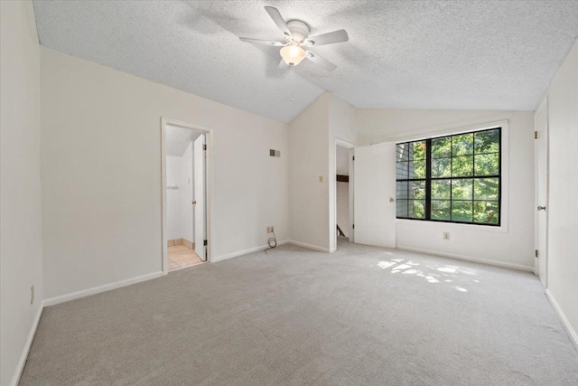 8174 Ravenhill Dr Unit 54, Germantown, TN 38138 - unfurnished bedroom featuring vaulted ceiling, a textured ceiling, carpet floors, baseboards, and ceiling fan