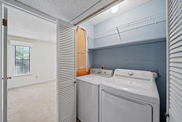 8174 Ravenhill Dr Unit 54, Germantown, TN 38138 - laundry room featuring separate washer and dryer, carpet flooring, baseboards, and a textured ceiling