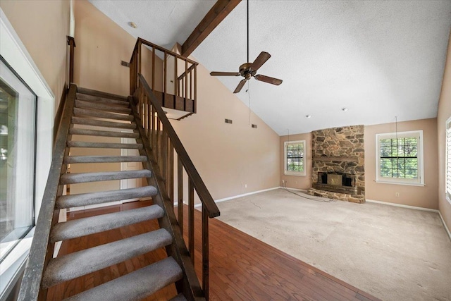 8174 Ravenhill Dr Unit 54, Germantown, TN 38138 - stairs with ceiling fan, high vaulted ceiling, healthy amount of natural light, baseboards, and a stone fireplace