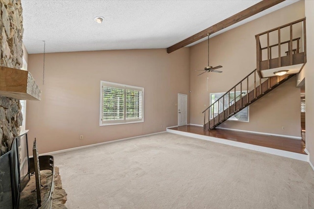 8174 Ravenhill Dr Unit 54, Germantown, TN 38138 - unfurnished living room featuring carpet, ceiling fan, stairway, a stone fireplace, and baseboards