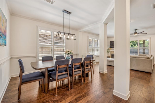 1668 Jennings Mill Ln, Collierville, TN 38017 - dining area featuring crown molding, hardwood / wood-style flooring, ceiling fan, a fireplace, and baseboards