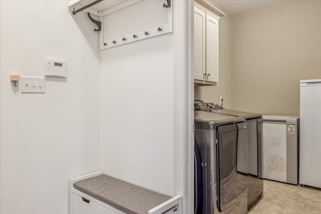 1668 Jennings Mill Ln, Collierville, TN 38017 - washroom featuring washer and clothes dryer and cabinet space