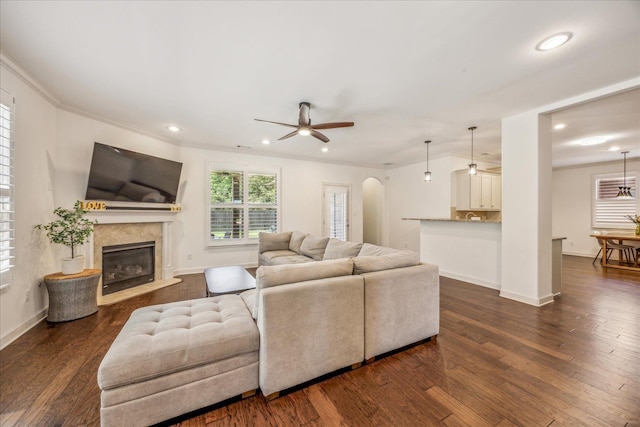 1668 Jennings Mill Ln, Collierville, TN 38017 - living room featuring recessed lighting, ceiling fan, dark wood-style floors, a glass covered fireplace, and baseboards