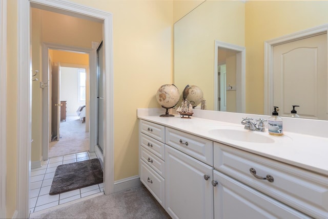 1245 Auburn Woods Dr, Collierville, TN 38017 - bathroom with vanity, tile patterned floors, and baseboards