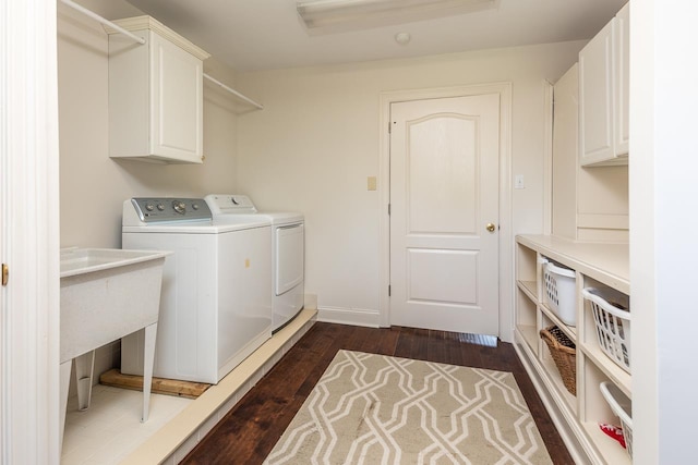 1245 Auburn Woods Dr, Collierville, TN 38017 - washroom featuring cabinet space, washing machine and clothes dryer, and dark wood-style flooring