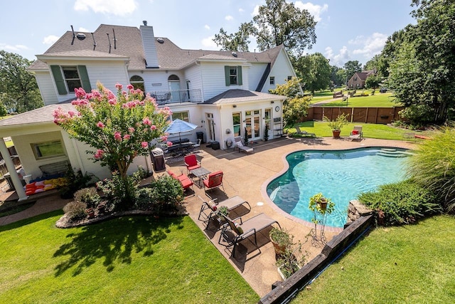 1245 Auburn Woods Dr, Collierville, TN 38017 - back of house featuring a patio area, a chimney, a balcony, french doors, and roof with shingles
