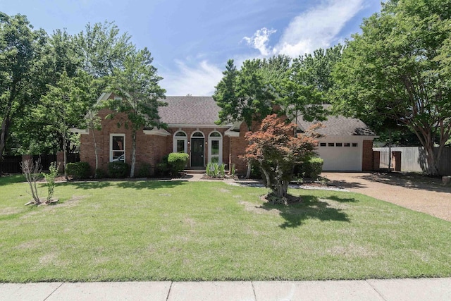 8432 Wood Shadows Ln, Memphis, TN 38018 - view of front facade featuring driveway, brick siding, and a garage