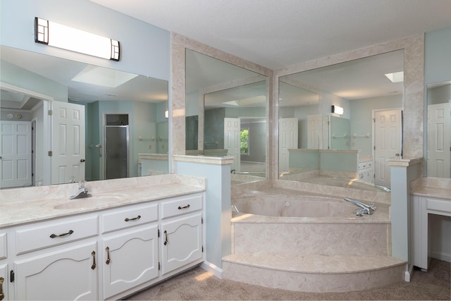 8432 Wood Shadows Ln, Memphis, TN 38018 - bathroom with a garden tub, vanity, and a stall shower