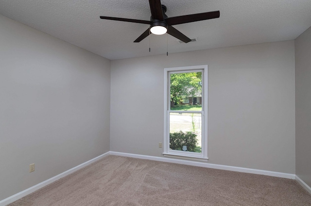 8432 Wood Shadows Ln, Memphis, TN 38018 - unfurnished room with a ceiling fan, light colored carpet, baseboards, and a textured ceiling