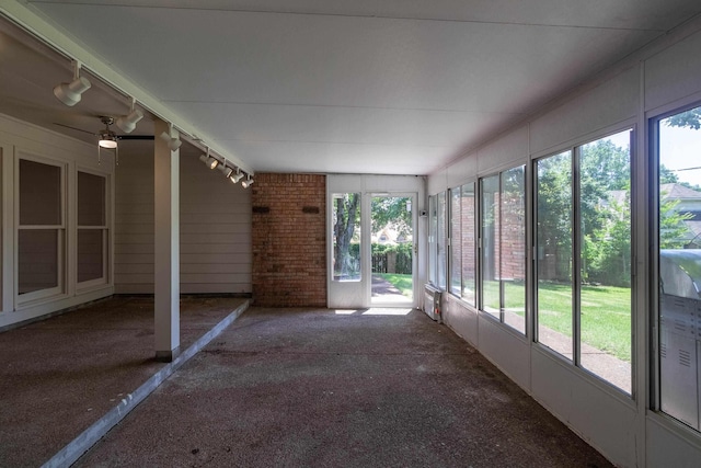 8432 Wood Shadows Ln, Memphis, TN 38018 - unfurnished sunroom featuring rail lighting, healthy amount of natural light, and ceiling fan