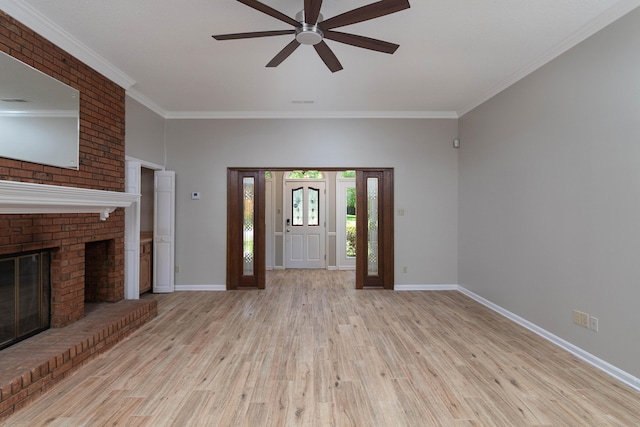 8432 Wood Shadows Ln, Memphis, TN 38018 - foyer entrance featuring wood finished floors, a ceiling fan, baseboards, crown molding, and a brick fireplace