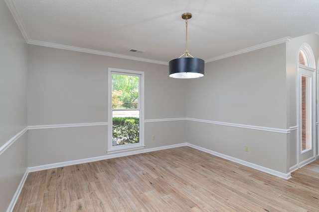 8432 Wood Shadows Ln, Memphis, TN 38018 - empty room with light wood-style floors, baseboards, and crown molding