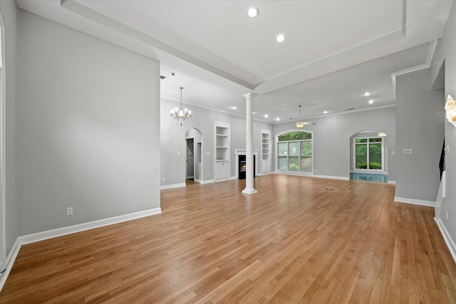 3559 Windgarden Cv, Memphis, TN 38125 - unfurnished living room with built in shelves, light wood-style floors, recessed lighting, ornate columns, and baseboards
