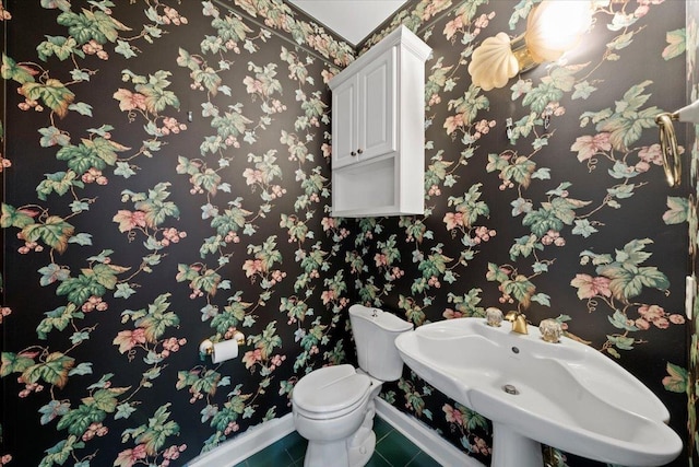 3559 Windgarden Cv, Memphis, TN 38125 - half bath with baseboards, tile patterned floors, toilet, and a sink