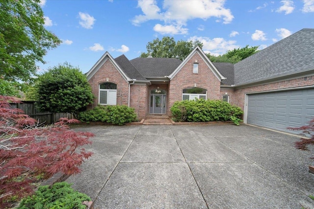 3559 Windgarden Cv, Memphis, TN 38125 - traditional-style house with brick siding, concrete driveway, and a shingled roof