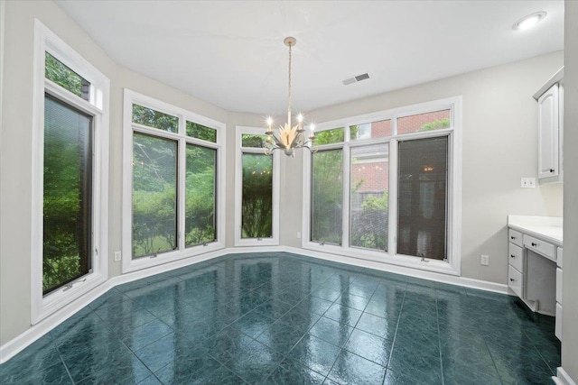 3559 Windgarden Cv, Memphis, TN 38125 - unfurnished sunroom with a chandelier