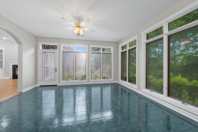 3559 Windgarden Cv, Memphis, TN 38125 - unfurnished sunroom with arched walkways, baseboards, and tile patterned floors