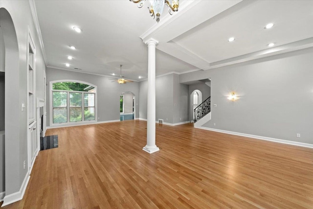 3559 Windgarden Cv, Memphis, TN 38125 - unfurnished living room featuring arched walkways, ornamental molding, recessed lighting, light wood-style flooring, and baseboards