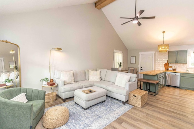 220 Harrison Rd, Michie, TN 38357 - living area featuring beam ceiling, high vaulted ceiling, light wood finished floors, ceiling fan, and a chandelier