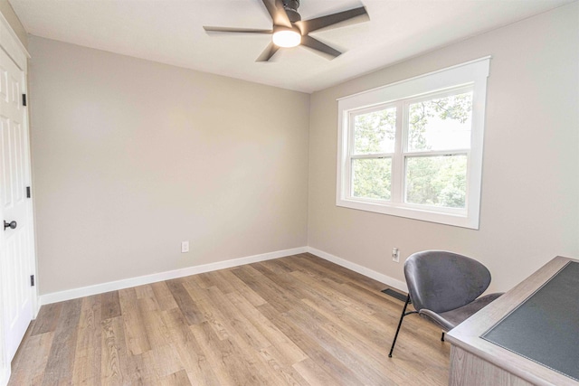 220 Harrison Rd, Michie, TN 38357 - home office with light wood-type flooring, baseboards, and a ceiling fan