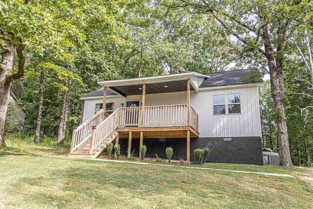 220 Harrison Rd, Michie, TN 38357 - view of front of property featuring a front yard, stairs, and roof with shingles