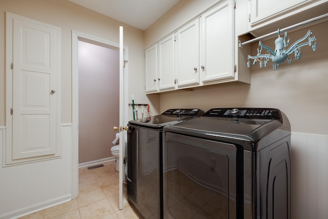 167 Ericson Rd, Memphis, TN 38018 - laundry area with separate washer and dryer, cabinet space, and baseboards