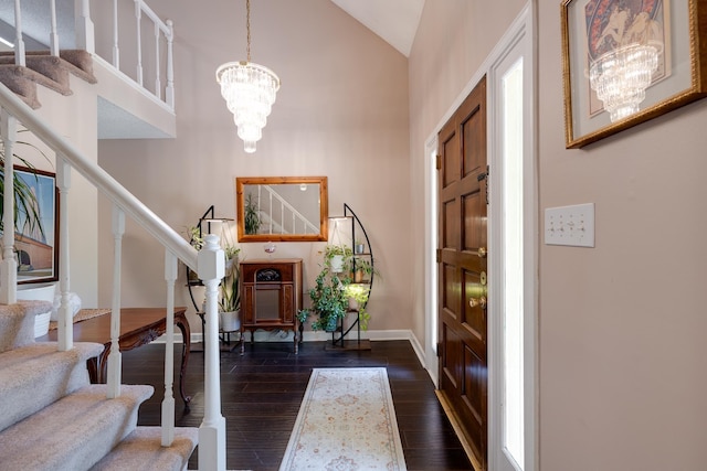 167 Ericson Rd, Memphis, TN 38018 - foyer with stairway, a chandelier, dark wood-style floors, high vaulted ceiling, and baseboards
