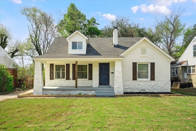 2551 Union Ave, Memphis, TN 38112 - view of front of property featuring a chimney, a front yard, covered porch, and roof with shingles