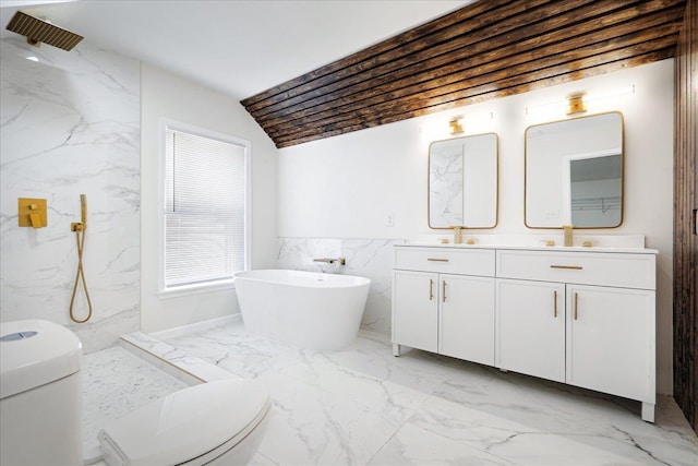 2551 Union Ave, Memphis, TN 38112 - bathroom featuring toilet, marble finish flooring, double vanity, a soaking tub, and tile walls