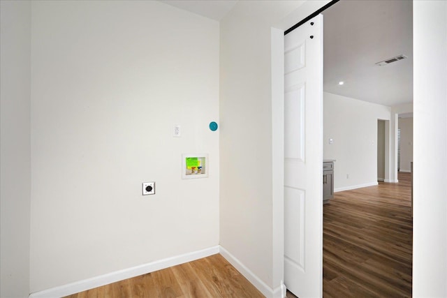2551 Union Ave, Memphis, TN 38112 - washroom featuring washer hookup, hookup for an electric dryer, light wood-style floors, and baseboards