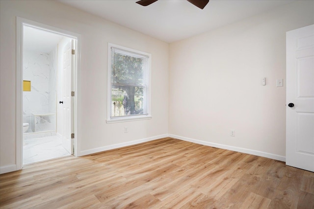 2551 Union Ave, Memphis, TN 38112 - empty room featuring light wood finished floors, a ceiling fan, and baseboards