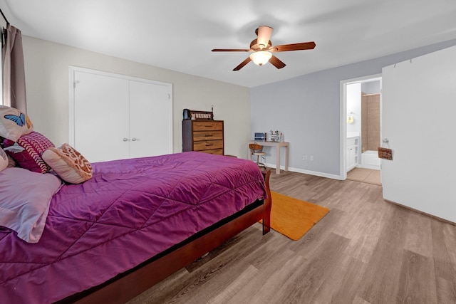 1822 Dragonfly Cv Unit 79, Germantown, TN 38138 - bedroom featuring light wood-style flooring, a closet, a ceiling fan, baseboards, and ensuite bathroom