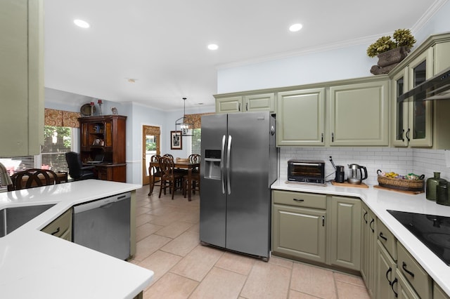 1620 Saddle Chase Cv, Memphis, TN 38016 - kitchen featuring stainless steel appliances, backsplash, light countertops, crown molding, and green cabinetry