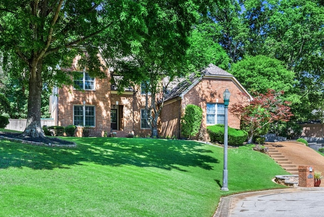 1620 Saddle Chase Cv, Memphis, TN 38016 - view of front of house with brick siding and a front lawn