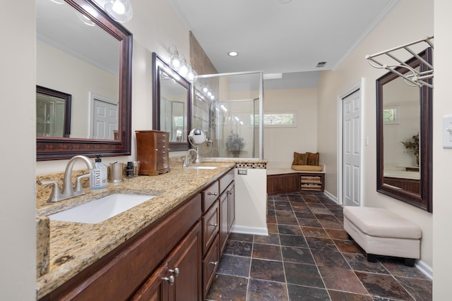 1620 Saddle Chase Cv, Memphis, TN 38016 - full bath featuring a stall shower, double vanity, stone finish floors, baseboards, and ornamental molding