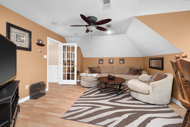 1620 Saddle Chase Cv, Memphis, TN 38016 - living room with light wood-type flooring, ceiling fan, a textured ceiling, and vaulted ceiling