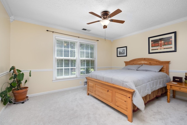 1620 Saddle Chase Cv, Memphis, TN 38016 - bedroom featuring ornamental molding, baseboards, a textured ceiling, light colored carpet, and a ceiling fan