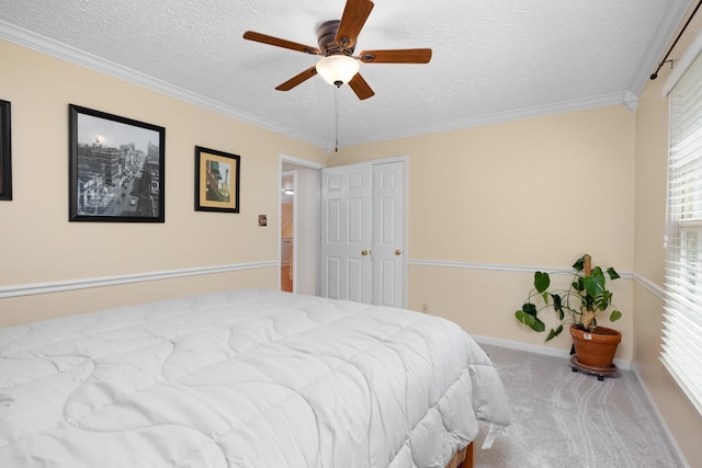1620 Saddle Chase Cv, Memphis, TN 38016 - bedroom featuring carpet, a textured ceiling, crown molding, a ceiling fan, and baseboards