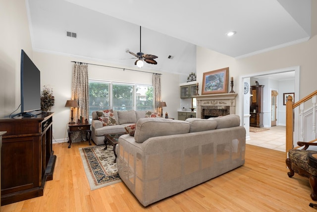 1620 Saddle Chase Cv, Memphis, TN 38016 - living room with ceiling fan, a fireplace, ornamental molding, light wood-type flooring, and baseboards