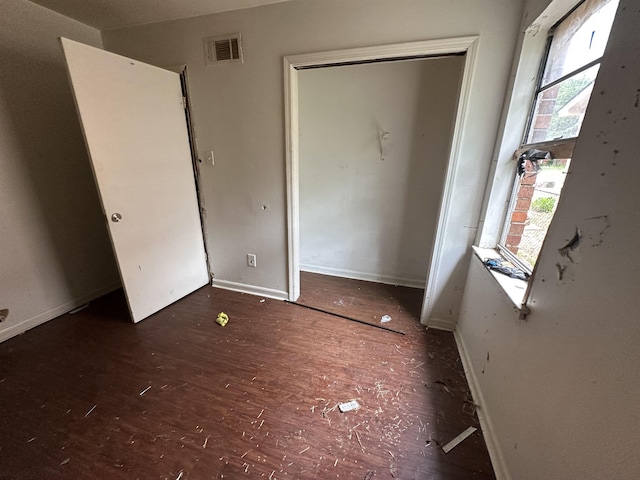 3421 Piney Woods Ave, Memphis, TN 38118 - unfurnished bedroom featuring multiple windows, baseboards, and a closet