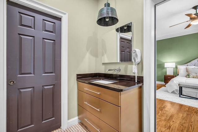 99 Red Acres Pl, Memphis, TN 38111 - ensuite bathroom featuring vanity, baseboards, a ceiling fan, and ornamental molding