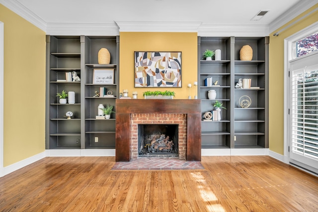 99 Red Acres Pl, Memphis, TN 38111 - unfurnished living room featuring wood finished floors, baseboards, a fireplace, and crown molding