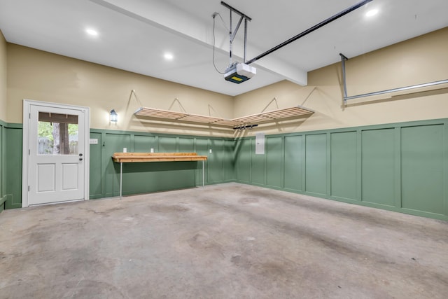99 Red Acres Pl, Memphis, TN 38111 - garage featuring a decorative wall, a garage door opener, recessed lighting, and wainscoting