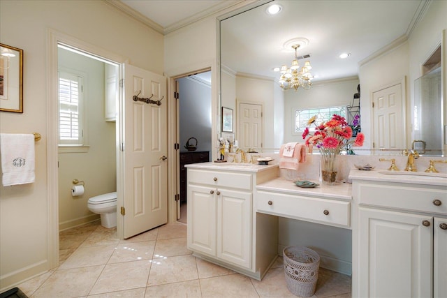 5239 Hedgewyck Ct, Memphis, TN 38117 - bathroom featuring double vanity, ornamental molding, plenty of natural light, and a chandelier