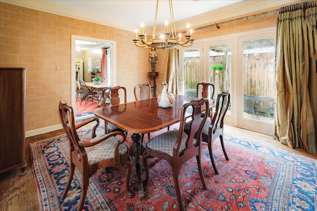 5239 Hedgewyck Ct, Memphis, TN 38117 - dining room featuring ornamental molding, a chandelier, and wood finished floors